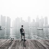 Guy standing at city harbour