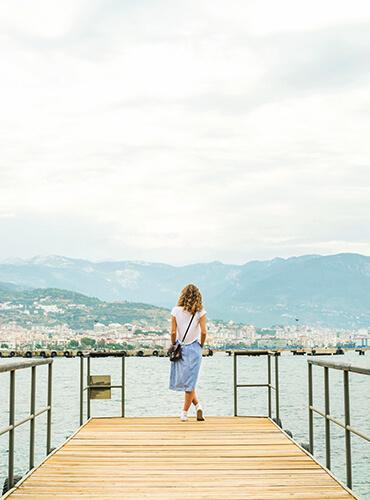 Woman standing at wharf